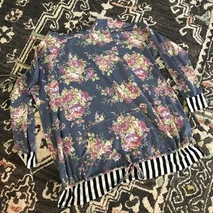 Floral sweater with black and white details.